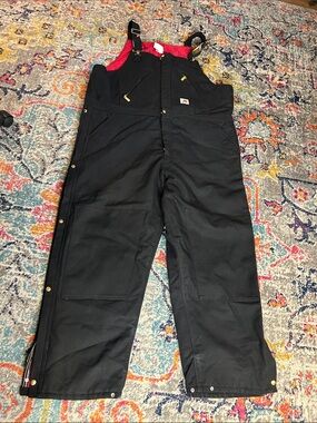 Carhartt Men’s Black Bib Overalls with Red Lining. Lightly used Minor scuffing